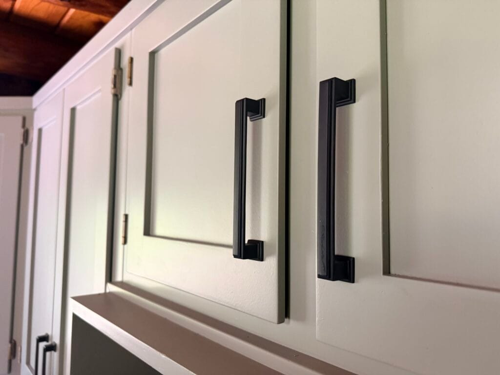 Refinished kitchen cabinets with black hardware in Easton, PA